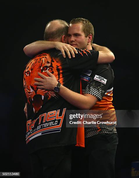 Raymond van Barneveld of Holland celebrates winning his first round match against Dirk van Duijvenbode during the 2016 William Hill PDC World Darts...