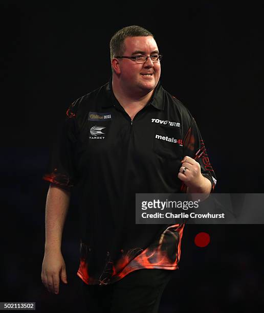 Stephen Bunting of England celebrates winning his first round match against Jyhan Artut of Germany during the 2016 William Hill PDC World Darts...