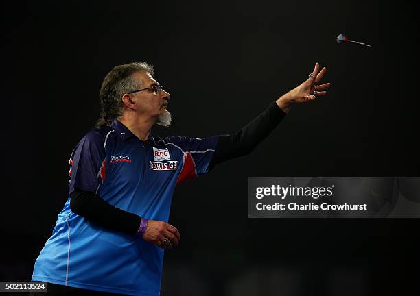 Aleksandr Oreshkin of Russia in action during his preliminary round match against Paul Lim of Singapore during the 2016 William Hill PDC World Darts...