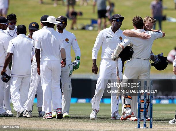 Kane Williamson and BJ Watling of New Zealand embrace after winning on day four of the second Test cricket match between New Zealand and Sri Lanka at...
