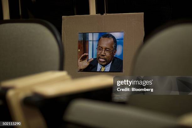 Photograph of Ben Carson, retired neurosurgeon and 2016 Republican presidential candidate, sits in the seating area as Carson speaks during a town...