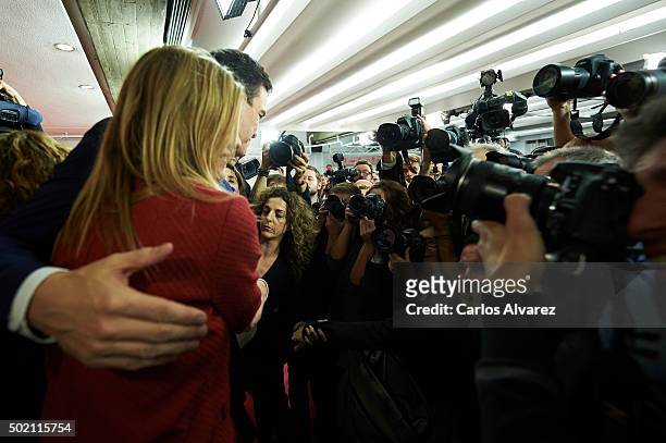 Leader of Spain's Socialist Party and candidate for general elections Pedro Sanchez and his wife Begona Fernandez greet supporters after the first...