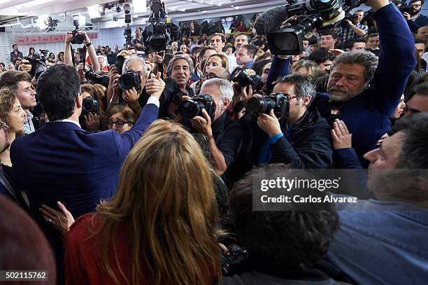 Leader of Spain's Socialist Party and candidate for general elections Pedro Sanchez and his wife Begona Fernandez greet supporters after the first...