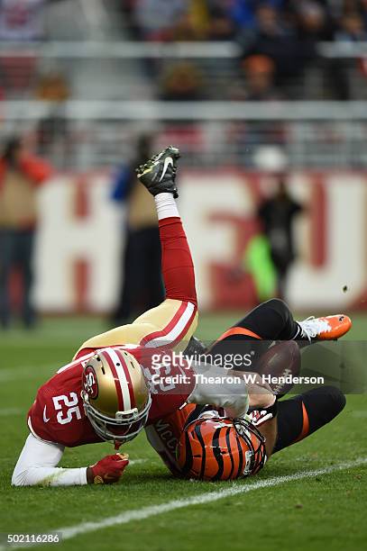 Jimmie Ward of the San Francisco 49ers sacks AJ McCarron of the Cincinnati Bengals during their NFL game at Levi's Stadium on December 20, 2015 in...