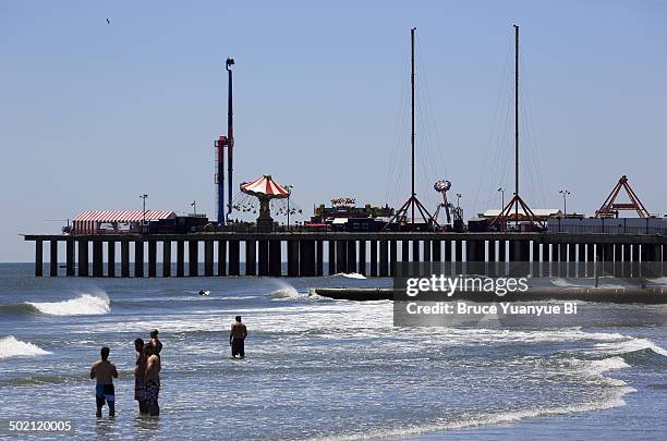 beach and steel pier amusement park - steel pier stock pictures, royalty-free photos & images