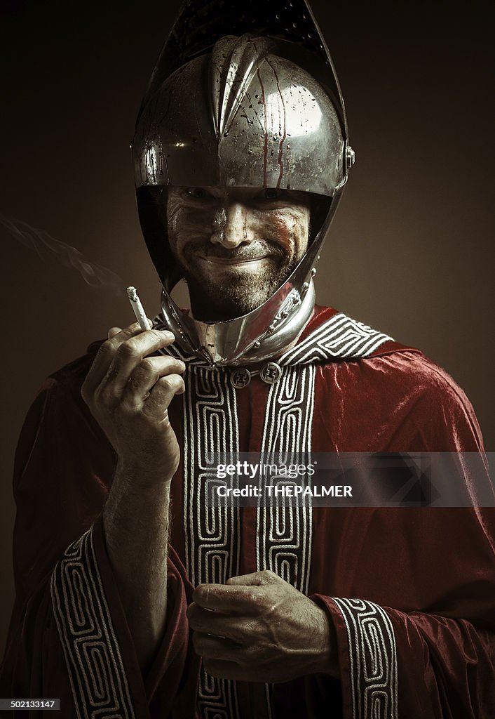 Bloody knight having a cigarette