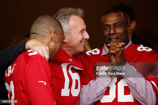 Former San Francisco 49ers players Roger Craig, Joe Montana and John Taylor are seen during a ceremony honoring the 1981-82 team at halftime of the...