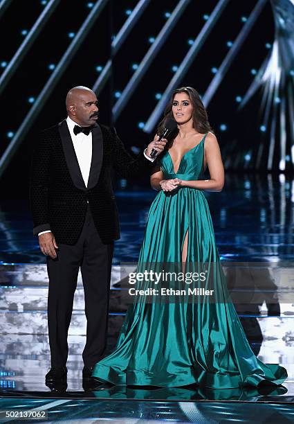 Television personality Steve Harvey interviews Miss Universe 2014 Paulina Vega onstage during the 2015 Miss Universe Pageant at The Axis at Planet...