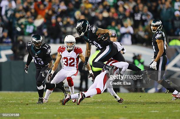Ryan Mathews of the Philadelphia Eagles is tackled by at Jerraud Powers of the Arizona Cardinals in the second quarter at Lincoln Financial Field on...