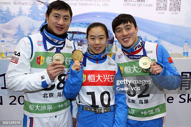 Gold medalists Liu Zhongqing, Kong Fanyu and Qi Guangpu of China celebrate after the Team Aerials Final match on day two of the 2015-2016 FIS...