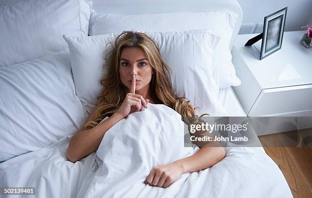 bedroom secret - woman hush stock pictures, royalty-free photos & images