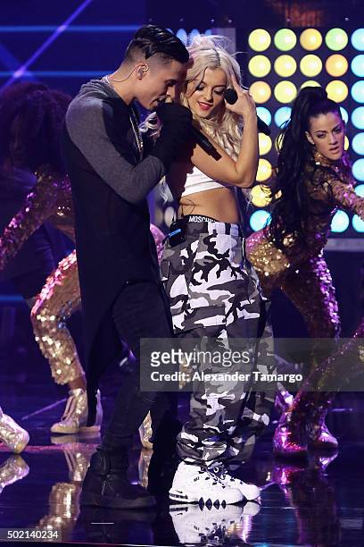 Reykon and Bebe Rexha perform onstage at Premios Univision Deportes 2015 at Univision Studios on December 20, 2015 in Miami, Florida.