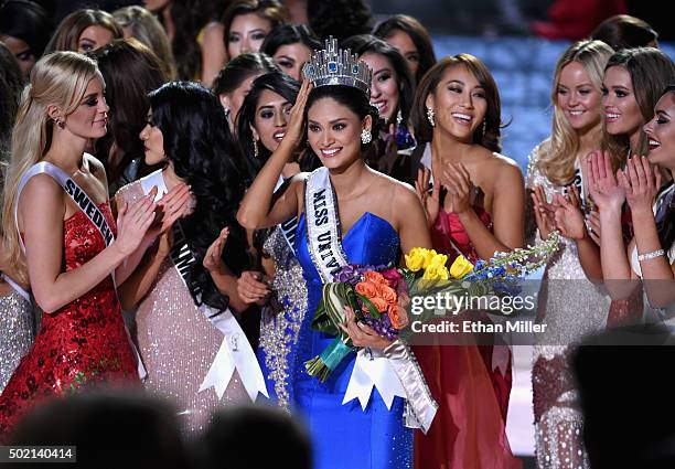 Miss Philippines 2015, Pia Alonzo Wurtzbach , who was mistakenly named as first runner-up reacts with other contestants after being named the 2015...