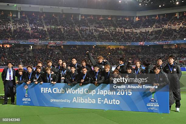 Members of Sanfrecce Hiroshima celebrate after winning the FIFA Club World Cup 3rd place match between Sanfrecce Hiroshima and Guangzhou Evergrande...