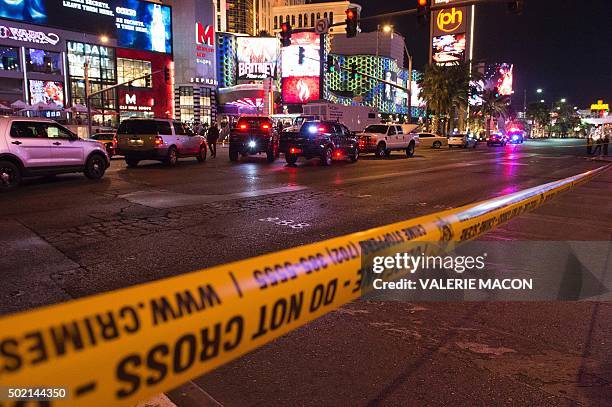 Police line blocks off part of the Las Vegas Strip after a car ran into a group of pedestrians between Planet Hollywood, where the Miss Universe...