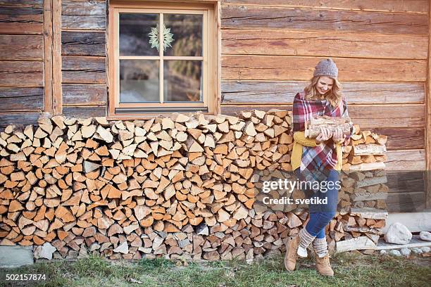 preparing for cozy night by fireplace - firewood stock pictures, royalty-free photos & images