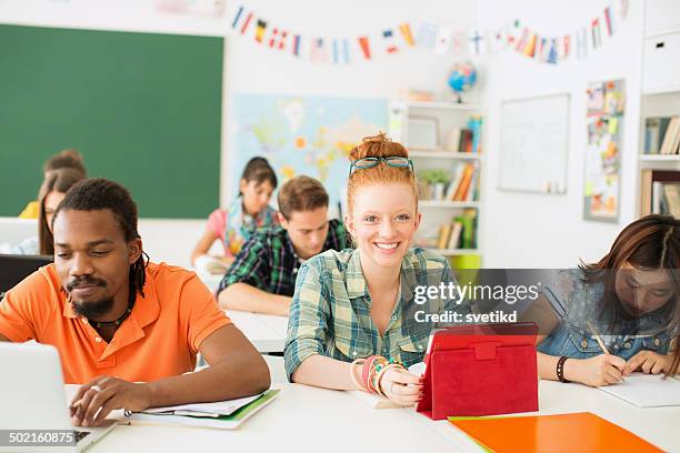 college students in a classroom. - non western script stock pictures, royalty-free photos & images