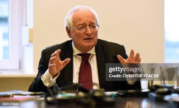 Hans-Joachim Eckert, head of the adjudicatory arm of FIFA's ethics commitee, gestures during a press conference on December 21, 2015 in Munich,...