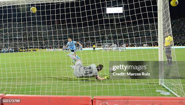 Franco Armani of Atletico Nacional stops a penalty during the penalty shootout of the second leg final match between Atletico Nacional and Atletico...