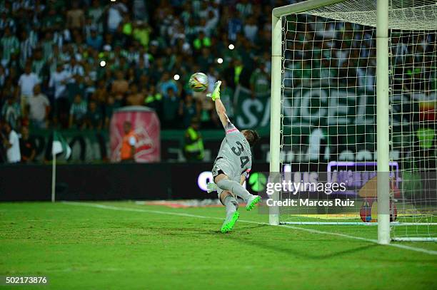 Franco Armani of Atletico Nacional stops a penalty to Gustavo Cuellar during the penalty shootout of the second leg final match between Atletico...