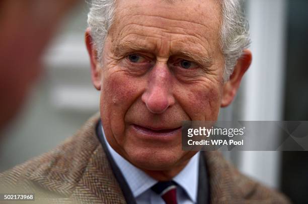 Prince Charles, Prince of Wales during a visit to victims of the flooding caused by Storm Desmond in Warwick Road on December 21 in Carlisle, United...