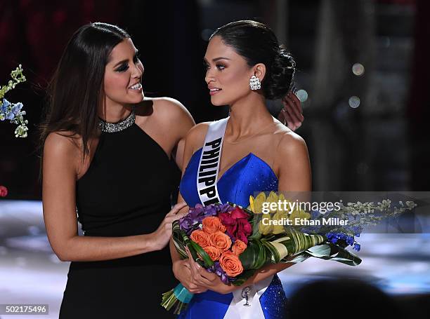 Miss Universe 2014 Paulina Vega hugs Miss Philippines 2015, Pia Alonzo Wurtzbach, after host Steve Harvey mistakenly named Miss Colombia 2015,...