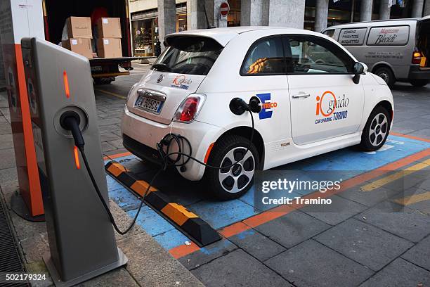 electric fiat 500c in network of car sharing in torino - fiat 500 c stock pictures, royalty-free photos & images
