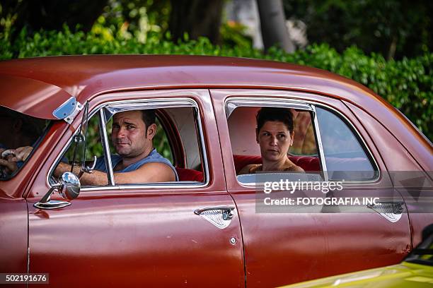 sharing a ride in havana - red hot cuba stock pictures, royalty-free photos & images