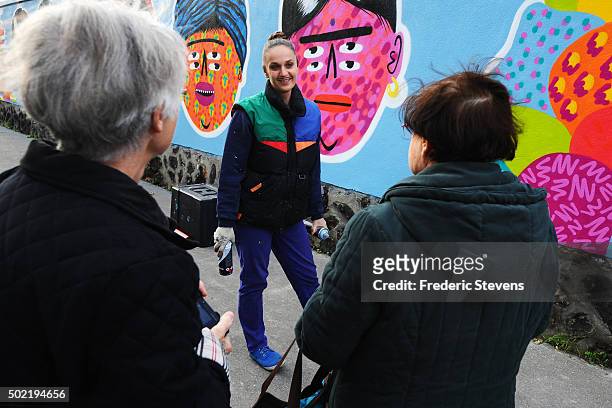 The artist Kashink speaks with people at the Rosa Parks Wall which consists of a huge street art mural 450 meters long made by iconic street-artist...