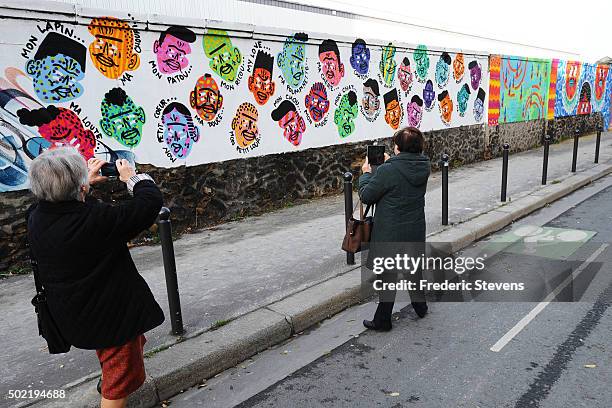 Person stops and looks at the Rosa Parks Wall which consists of a huge street art mural 450 meters long made by iconic street-artist team composed of...