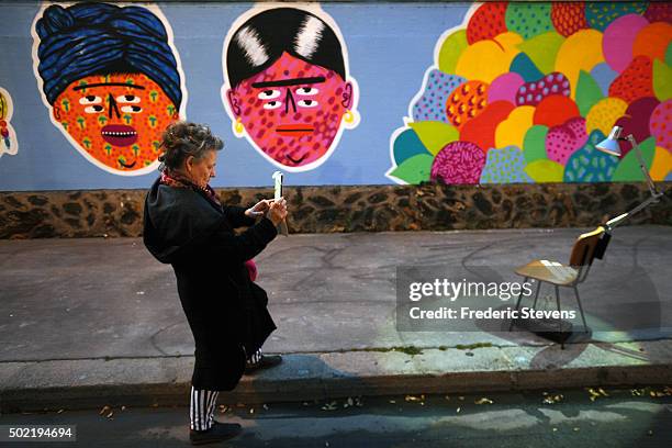 One person stops and looks at the Rosa Parks Wall which consists of a huge street art mural 450 meters long made by iconic street-artist team...