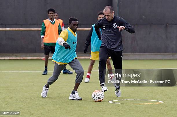 Everton manager Roberto Martinez coaches a group of refugees during an Everton in the Commity Project on December 14, 2015 in Liverpool, England.