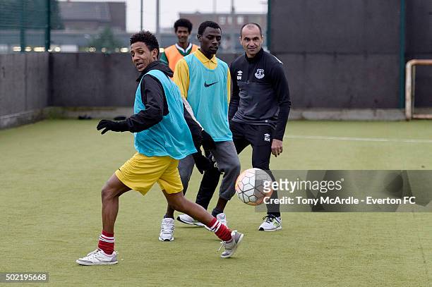 Everton manager Roberto Martinez coaches a group of refugees during an Everton in the Commity Project on December 14, 2015 in Liverpool, England.