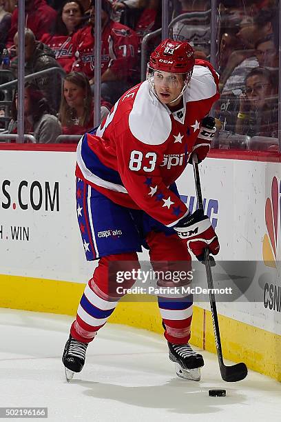 Jay Beagle of the Washington Capitals controls the puck against the Ottawa Senators in the second period during an NHL game at Verizon Center on...