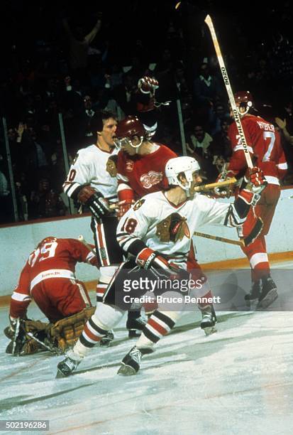 Denis Savard of the Chicago Blackhawks celebrates a goal during an NHL game against the Detroit Red Wings circa 1985 at the Chicago Stadium in...