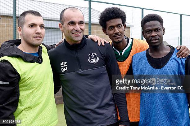 Everton manager Roberto Martinez poses for pictures as he coaches a group of refugees during an Everton in the Commity Project on December 14, 2015...