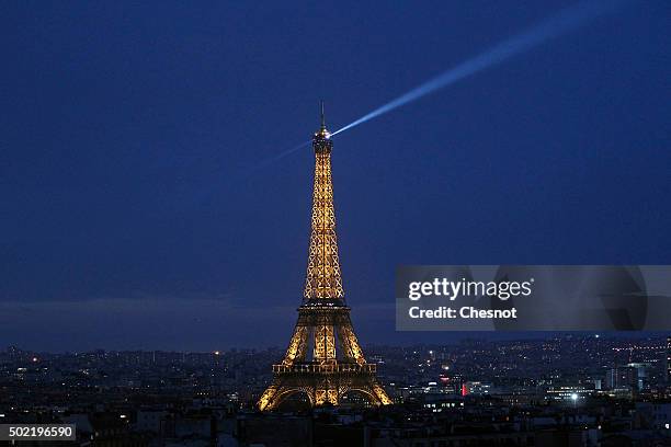 The Eiffel Tower by night is seen from the "Arc de triomphe" on December 21, 2015 in Paris, France. Tourists from around the world will visit the...