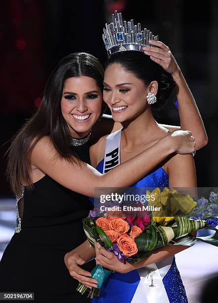 Miss Universe 2014 Paulina Vega hugs Miss Philippines 2015, Pia Alonzo Wurtzbach, after host Steve Harvey mistakenly named Miss Colombia 2015,...