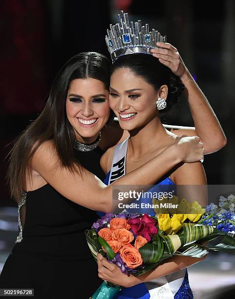 Miss Universe 2014 Paulina Vega hugs Miss Philippines 2015, Pia Alonzo Wurtzbach, after host Steve Harvey mistakenly named Miss Colombia 2015,...
