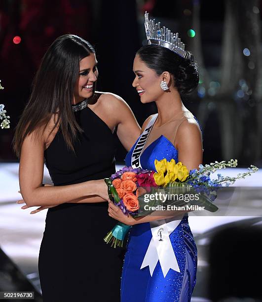 Miss Universe 2014 Paulina Vega hugs Miss Philippines 2015, Pia Alonzo Wurtzbach, after host Steve Harvey mistakenly named Miss Colombia 2015,...