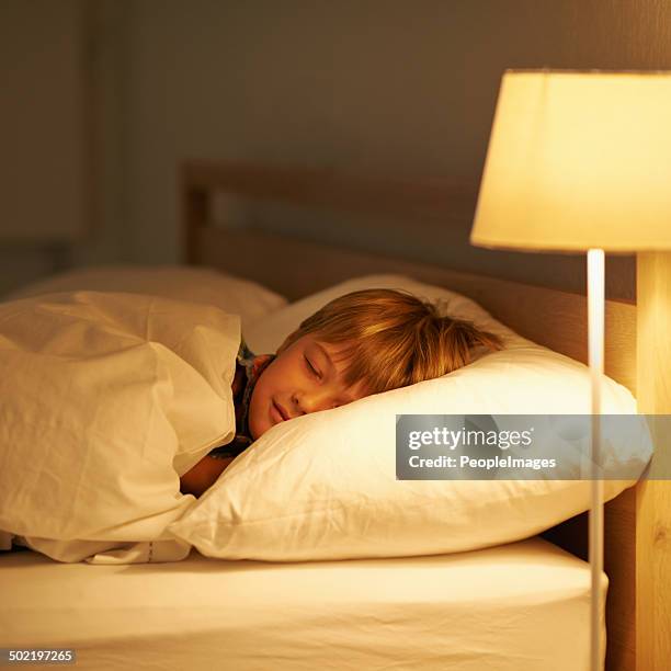 he always sleeps so peacefully - beds dreaming children stock pictures, royalty-free photos & images