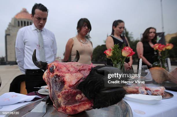 Detail of a cow head during a performance of Animal Heroes NGO to denounce the excessive consumption of meat during the Christmas season at...