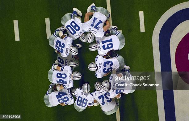 Super Bowl XXVIII: Aerial view of Dallas Cowboys QB Troy Aikman leading huddle with teammates during game vs Buffalo Bills at Georgia Dome. Atlanta,...