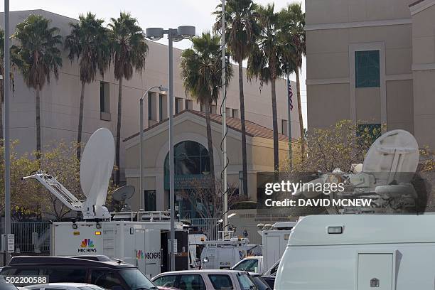 Television news crews wait outside the United States District Court building as Enrique Marquez appears at a detention hearing in federal court in...