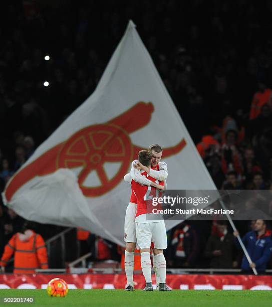 Per Mertesacker and Aaron Ramsey celebrate the Arsenal win after the Barclays Premier League match between Arsenal and Manchester City at Emirates...