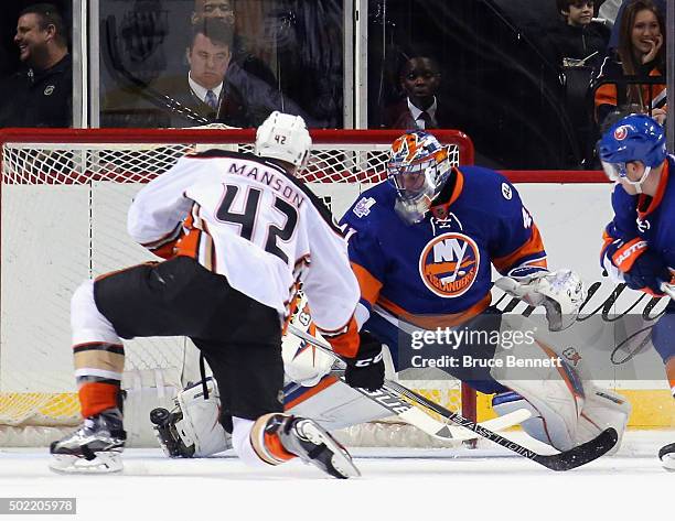 Jaroslav Halak of the New York Islanders makes the second period toe save on Josh Manson of the Anaheim Ducks at the Barclays Center on December 21,...