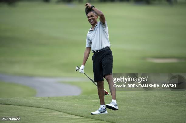 President Barack Obama arrives on the 18th hole of the Mid-Pacific Country Club's golf course December 21, 2015 in Kailua, Hawaii. Obama and the...