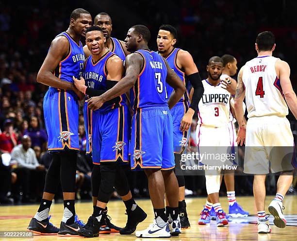 Russell Westbrook of the Oklahoma City Thunder celebrates his defense on J.J. Redick of the Los Angeles Clippers with Kevin Durant, Serge Ibaka and...