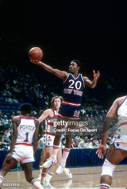 Michael Ray Richardson of the New York Knicks shoots over Kevin Porter of the Washington Bullets during an NBA basketball game circa 1980 at the...