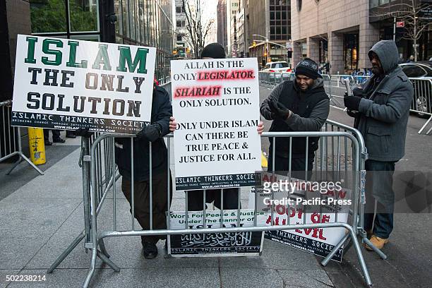 Group of Muslim-American men advocating for Shariah law rally apart from the larger demonstration, insisting that the aims of the demonstrators are...